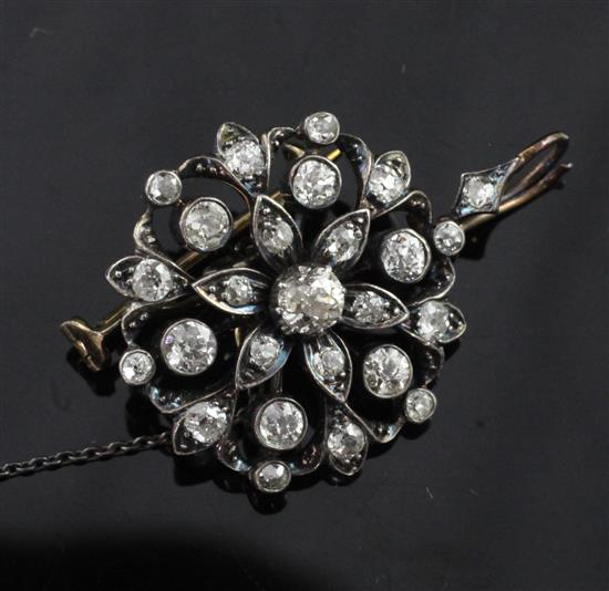 A Victorian gold, silver and diamond cluster pendant with brooch attachment, 1.25in inc. bale.